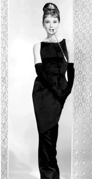 Audrey Hepburn wearing the iconic black dress from "Breakfast at Tiffany's"
